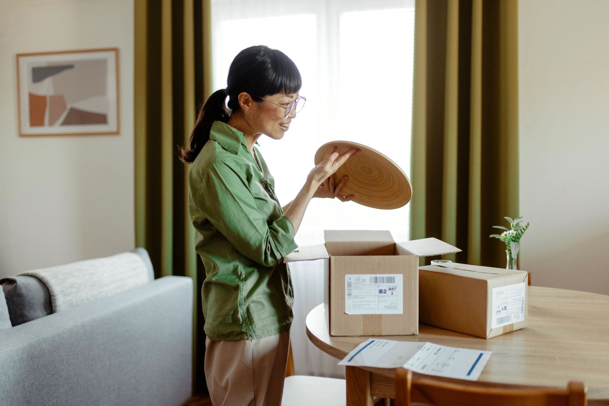 Customer receiving and opening a delivered package at home