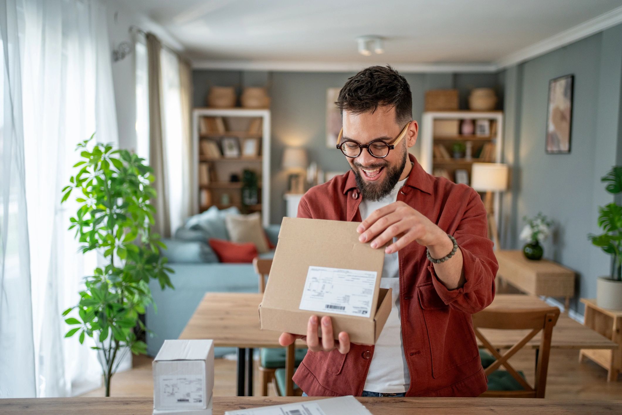 Customer opening a delivered online order at home